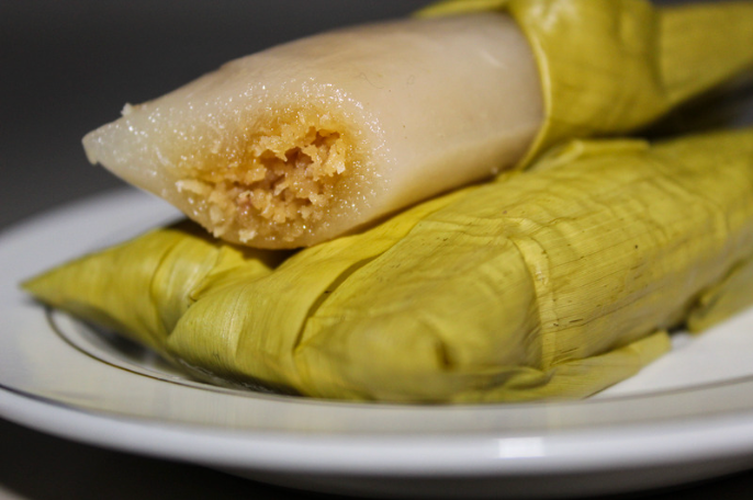 Timphan, a traditional Acehnese steamed rice cake wrapped in banana leaf