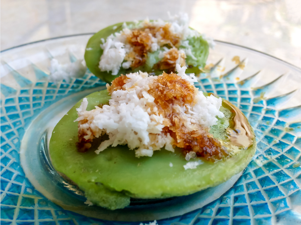 Balinese laklak rice cakes with grated coconut and palm sugar syrup