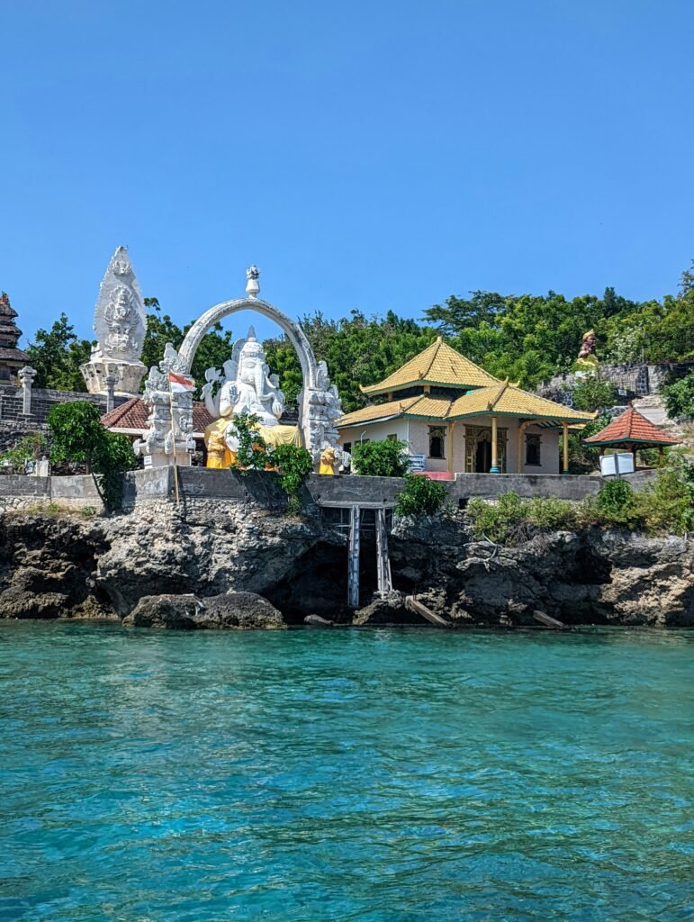 Hindu temple complex on Menjangan Island in West Bali, overlooking clear turquoise water.
