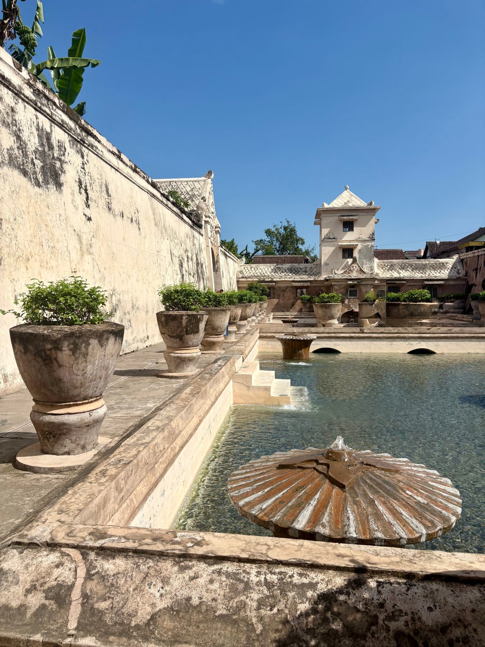 Taman Sari’s bathing pool and stone fountains, featured in our One Week in Yogyakarta itinerary.
